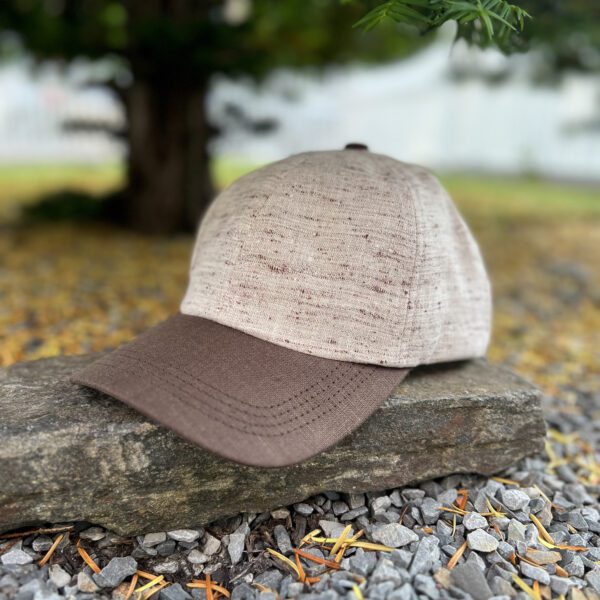 A hat sitting on top of a rock.